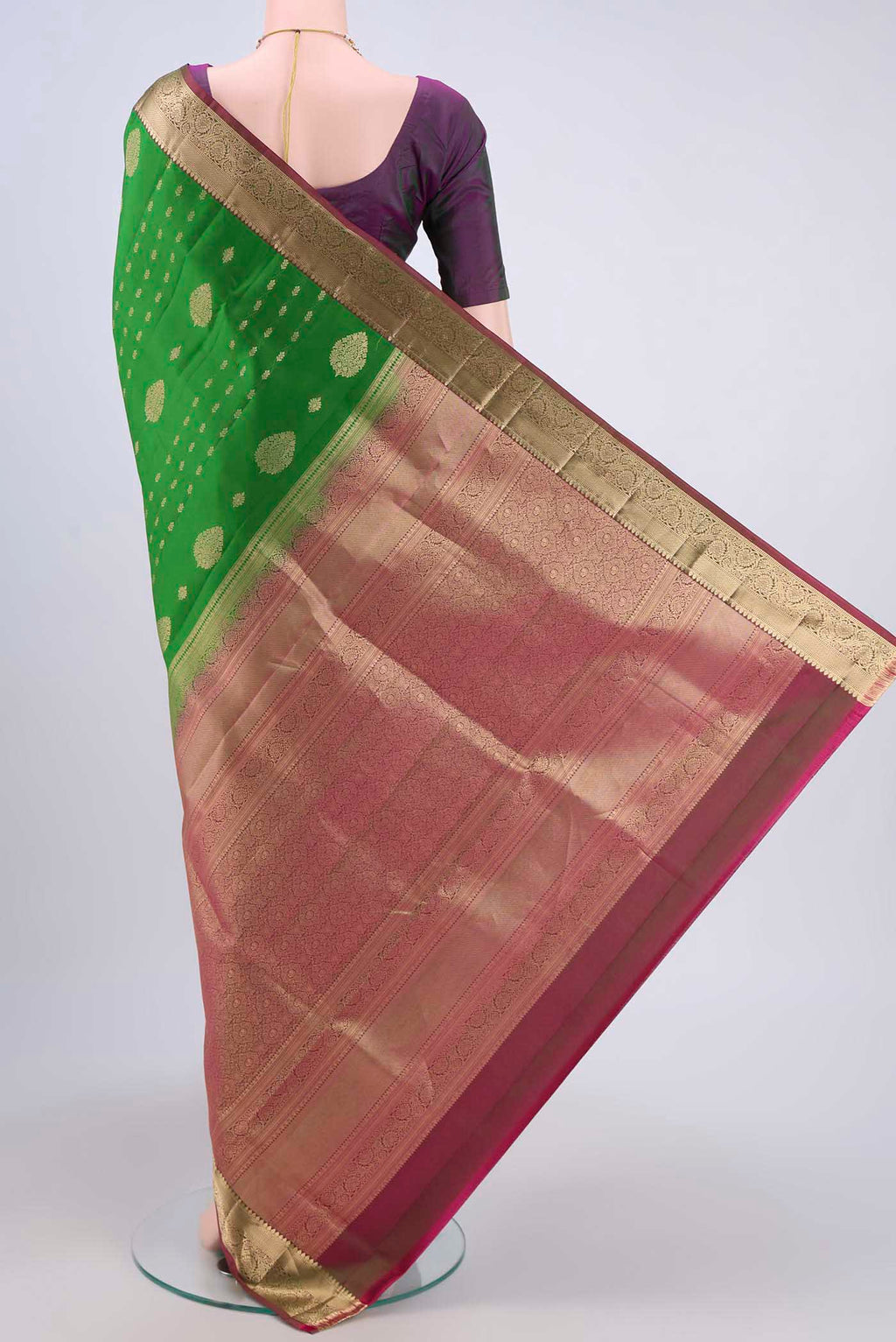 Flat view of Green Soft Silk Saree with Zari Butta on the body and Fancy Border. 