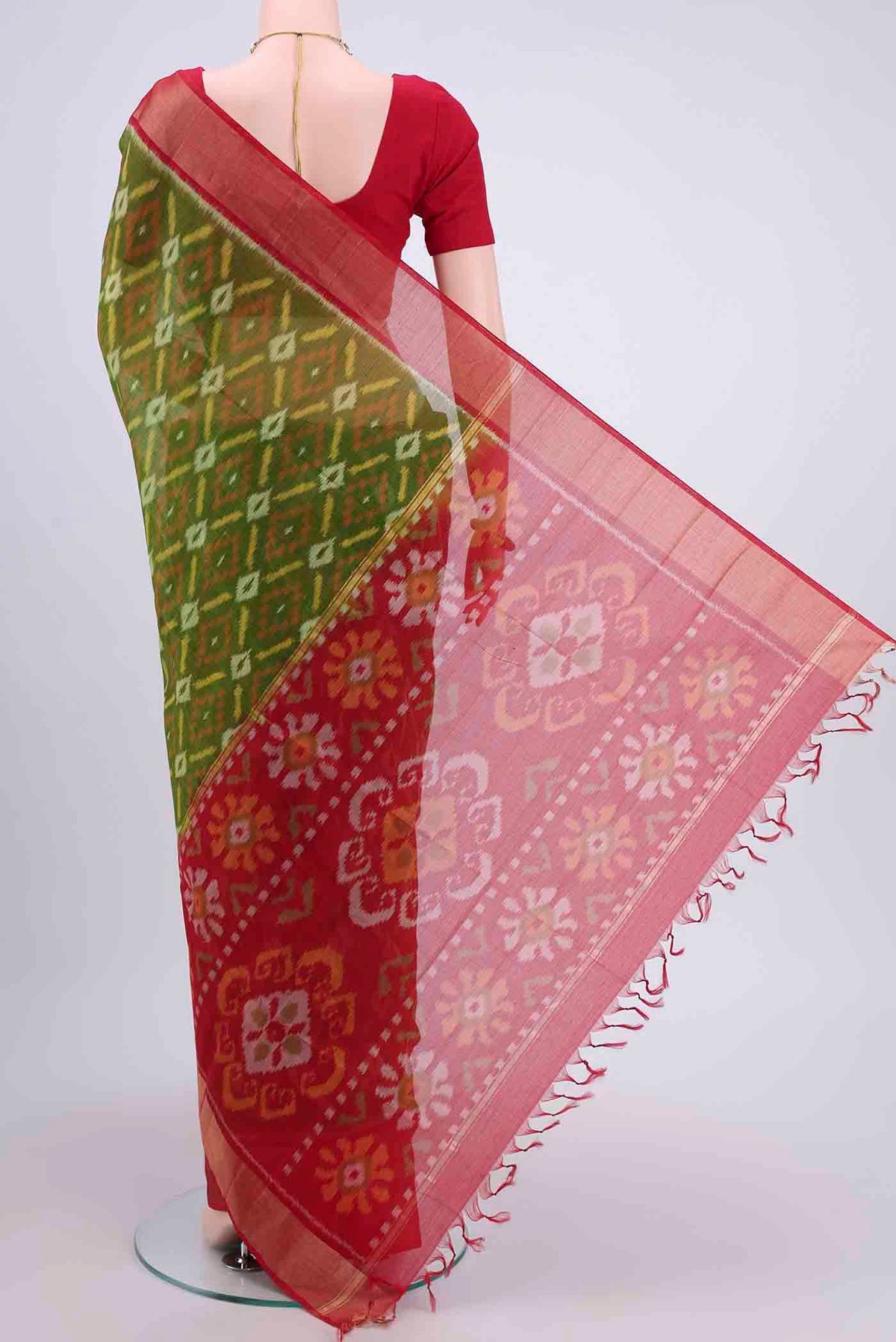 Flat view of Mehandi Green Kora Cotton Saree with Ikat design on the body and Zari Border