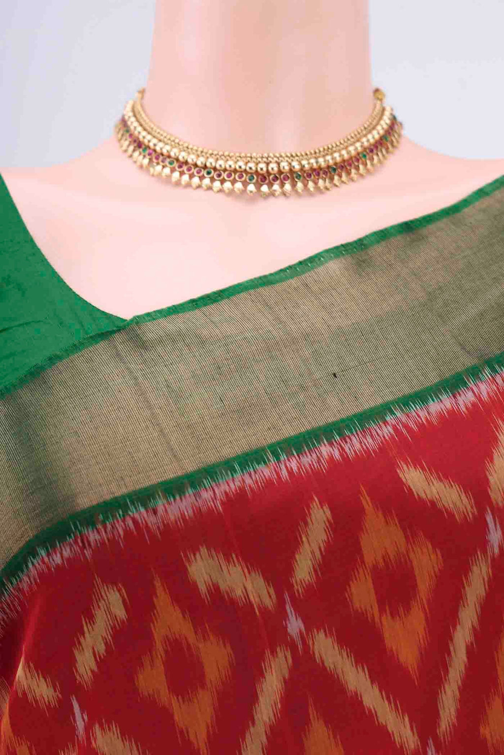 Border image of Red Kora Cotton Saree with Ikat design on the body and Zari Border