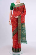 Red Kora Cotton Saree with Ikat design on the body and Zari Border displayed on a mannequin