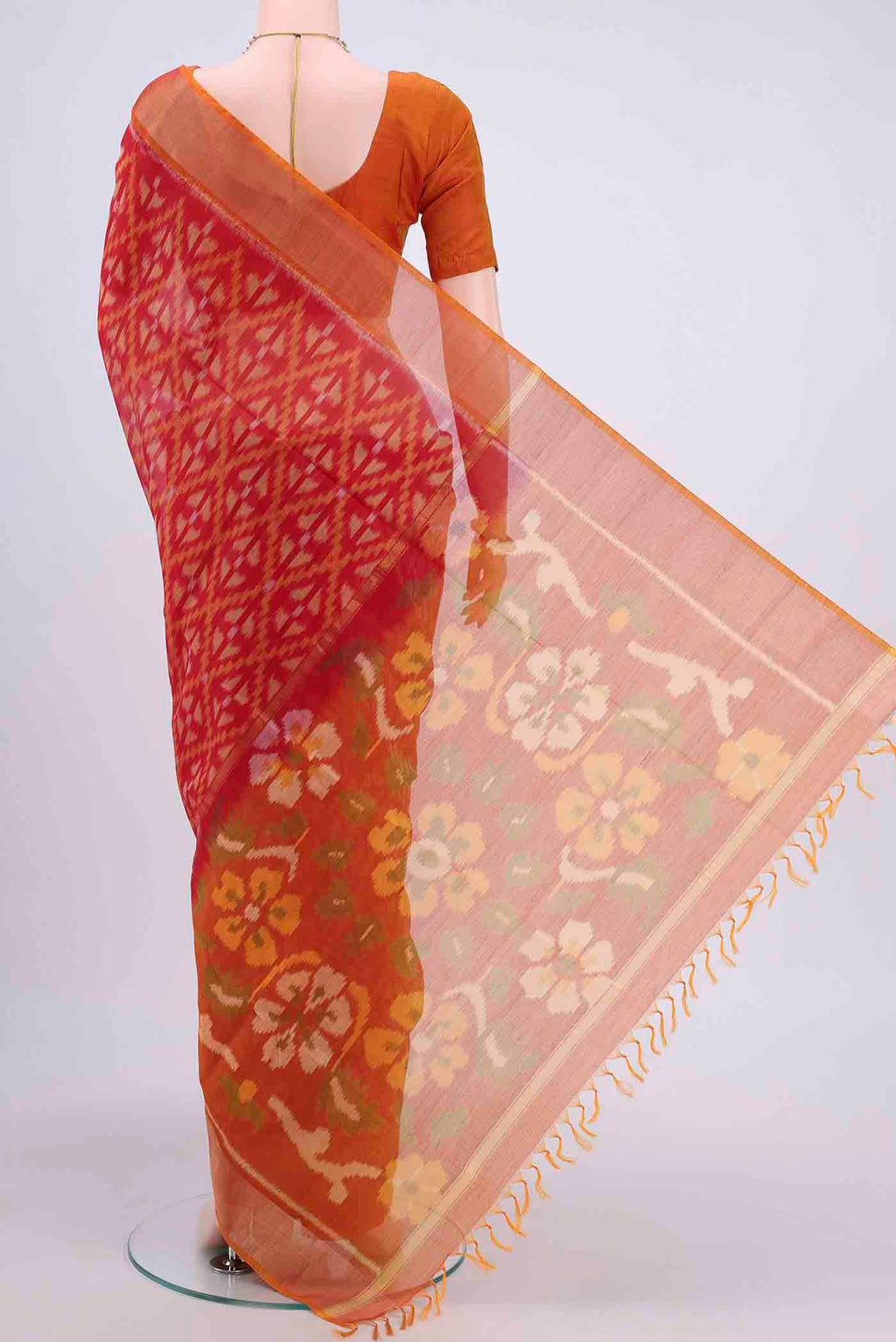 Flat view of Red Pochampally Saree with Ikat design on the body and Zari Border