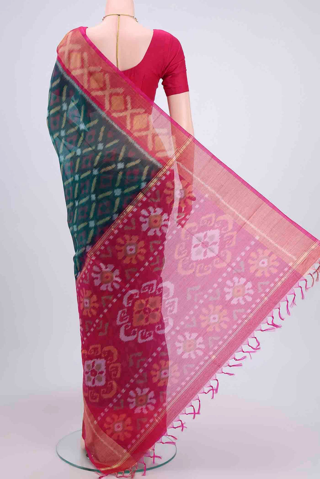 Flat view of Peacock Blue Kora Cotton Saree with Ikat design on the body and Zari Border