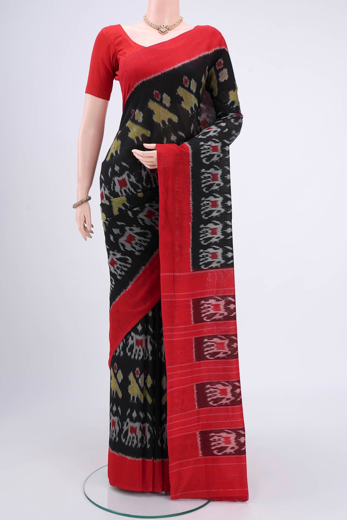 Black Pochampally Cotton Saree with Ikat design on the body and Ikat Border.  displayed on a mannequin