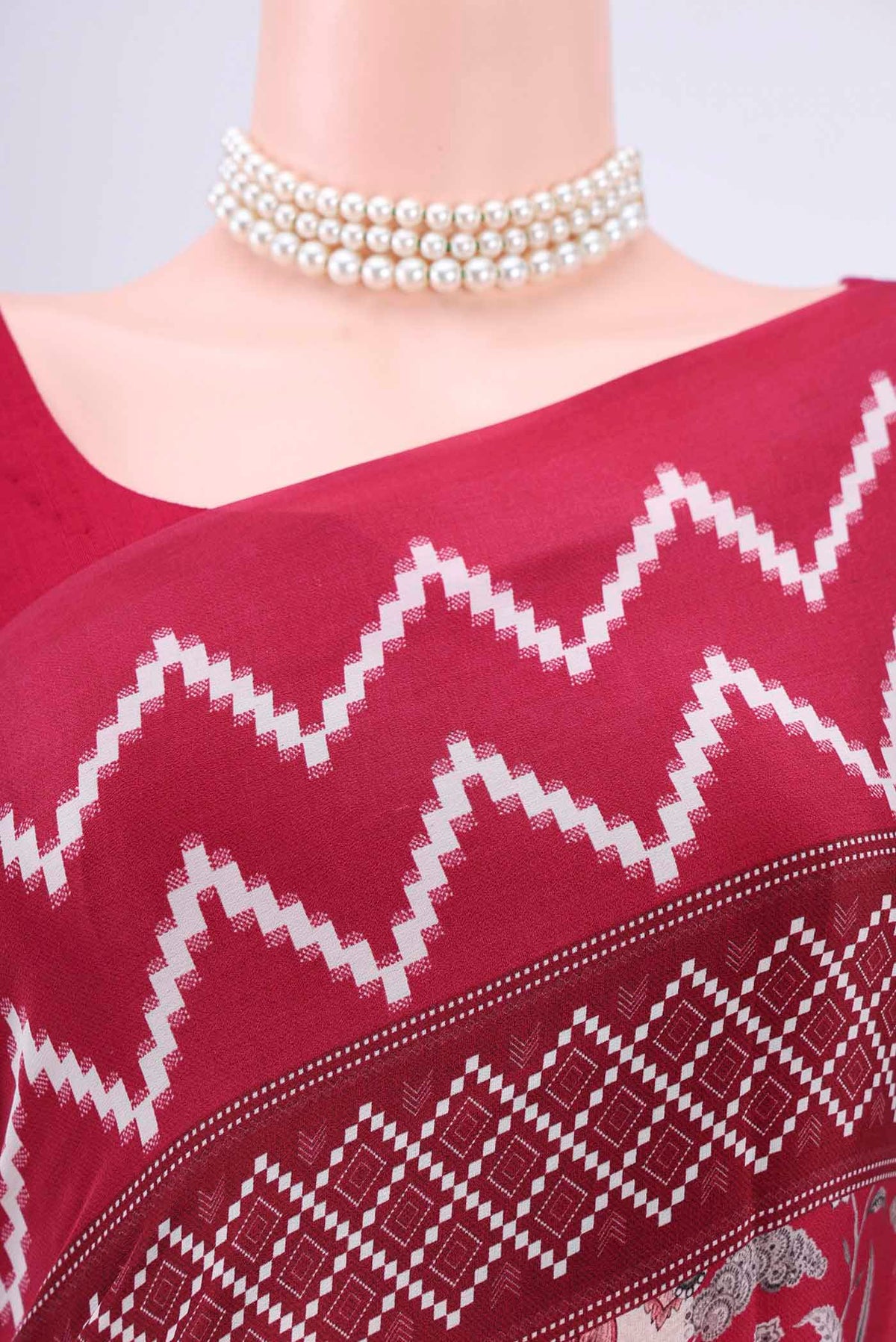 Border image of Maroon Crepe Saree with Floral Print on the body and Plain Border. 