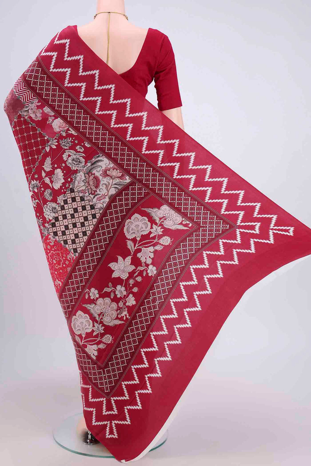Flat view of Maroon Crepe Saree with Floral Print on the body and Plain Border. 