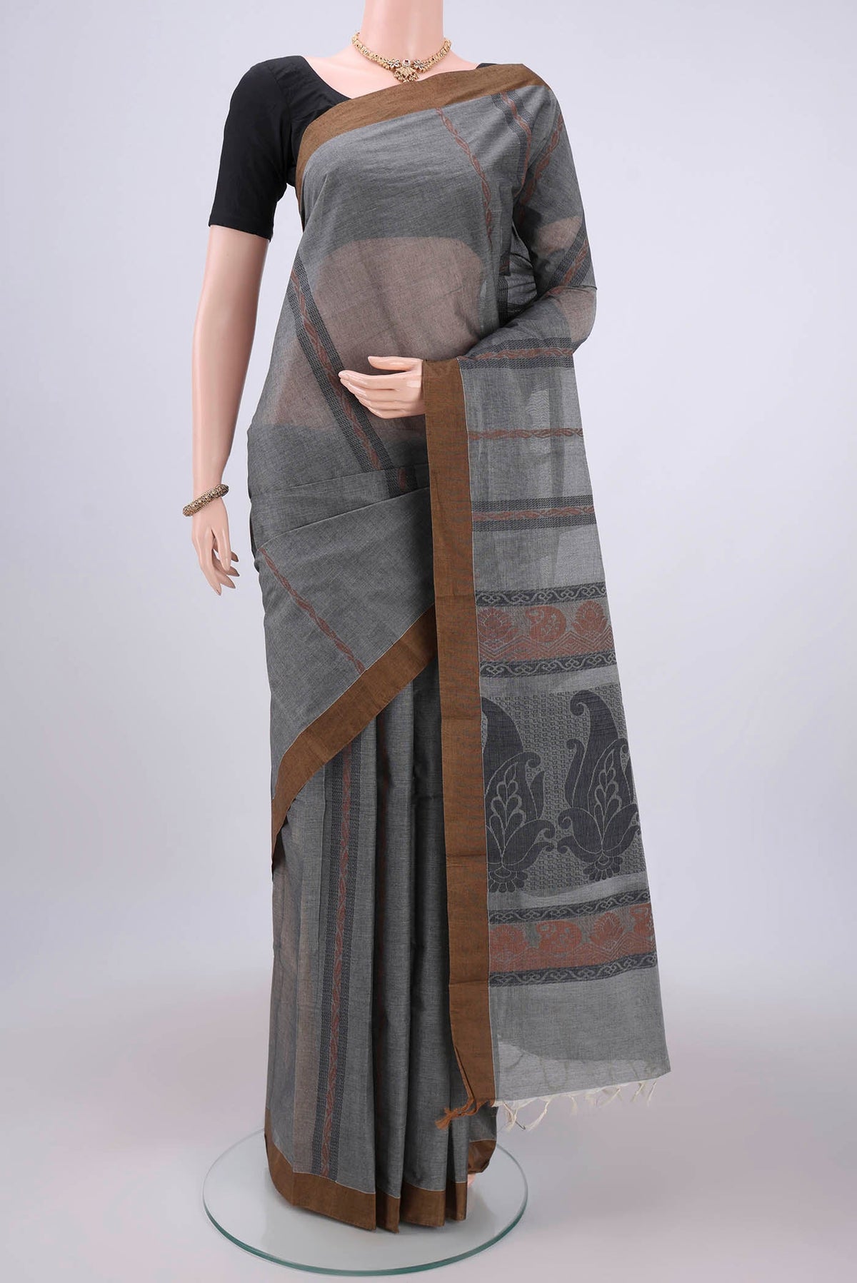 Grey Kanchi Cotton Saree with Stripes on the body and Thread Border.  displayed on a mannequin