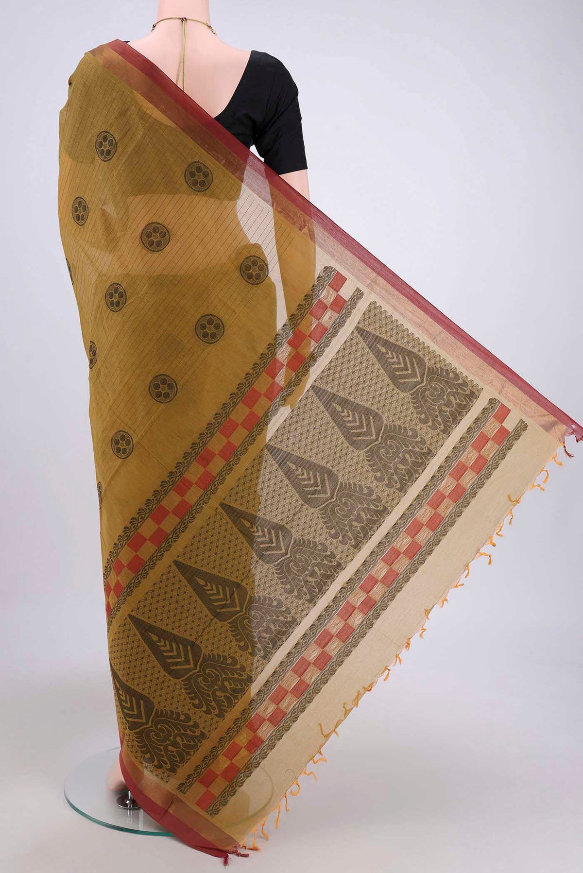 Flat view of Mustard Kanchi Cotton Saree with Stripes on the body and Zari Border. 