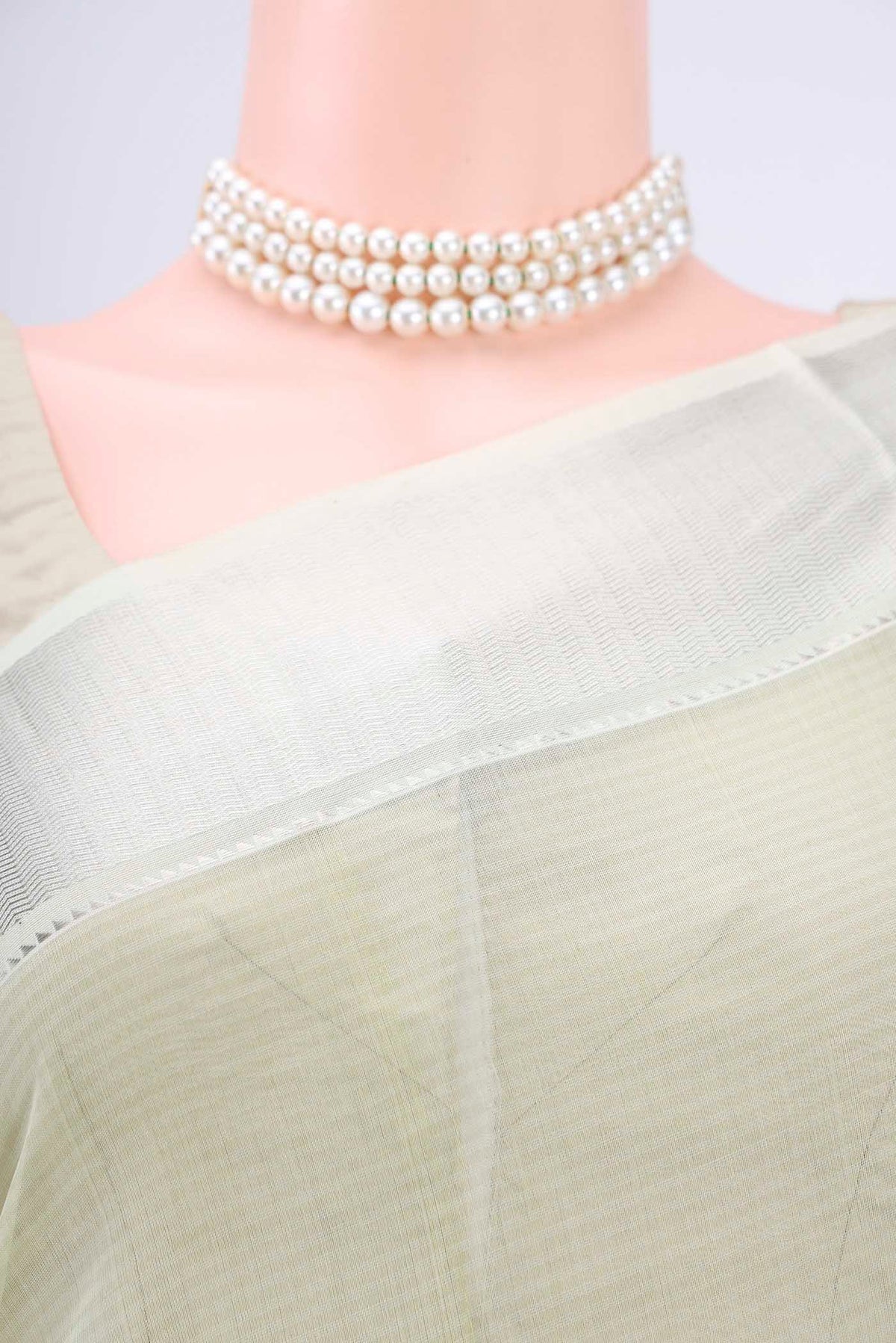 Border image of Sage Green Maheshwari Silk Cotton Saree with Plain Body and Zari Border. 