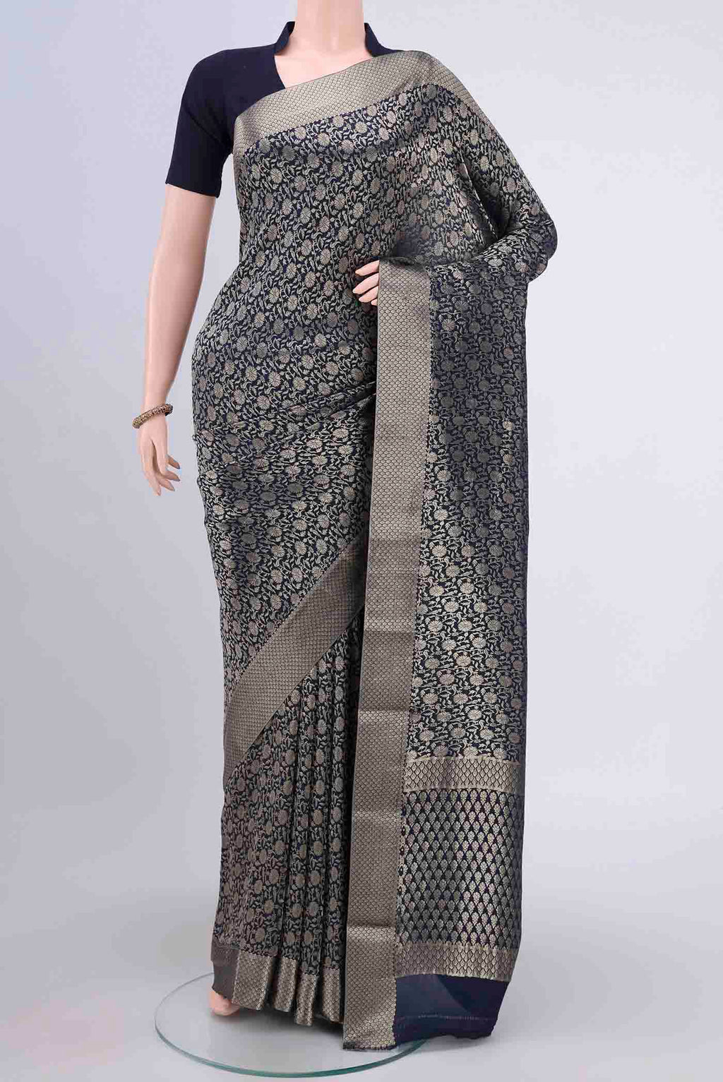 Navy Blue Mysore Crepe Saree with Zari Brocade on the body and Zari Border.  displayed on a mannequin
