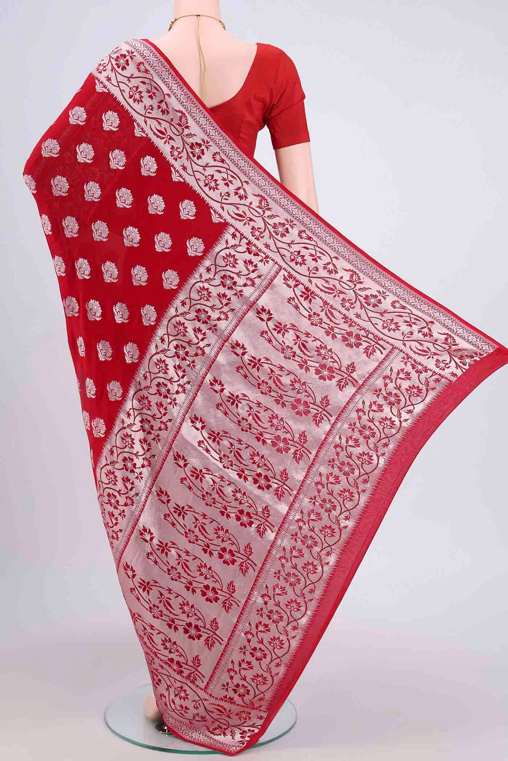 Flat view of Red Banarasi Georgette Saree with Zari Brocade on the body and Zari Border. 