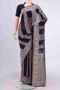 Navy Blue Banarasi Georgette Saree with Zari Brocade on the body and Zari Border.  displayed on a mannequin