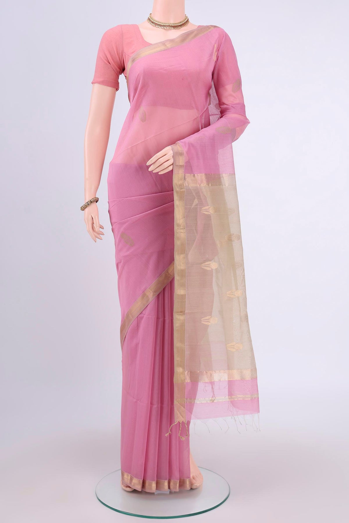 Rose pink Maheshwari Silk Cotton Saree with Zari Butta on the body and Zari Border.  displayed on a mannequin