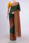Bottle Green Coimbatore Cotton Saree with Stripes on the body and Plain Border.  displayed on a mannequin
