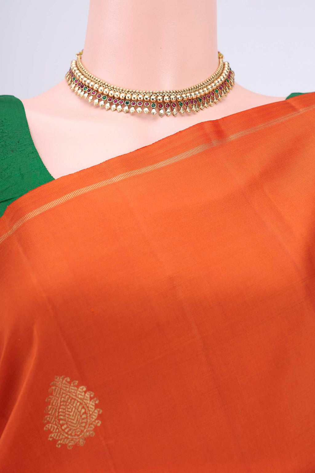 Border image of Pure Silk Pure Zari Rust Kanchipuram Saree with Zari Butta on the body and Thin Zari Line. 