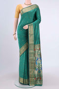 Sea Green Blended Bangalore Silk Saree with Jacquard With Zari Butta on the body and Zari Border.  displayed on a mannequin