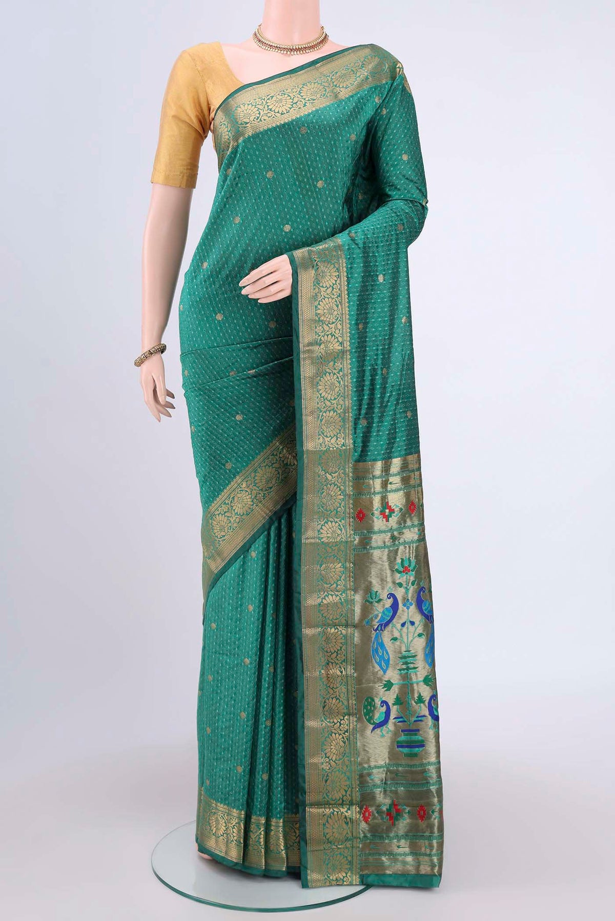Sea Green Blended Bangalore Silk Saree with Jacquard With Zari Butta on the body and Zari Border.  displayed on a mannequin