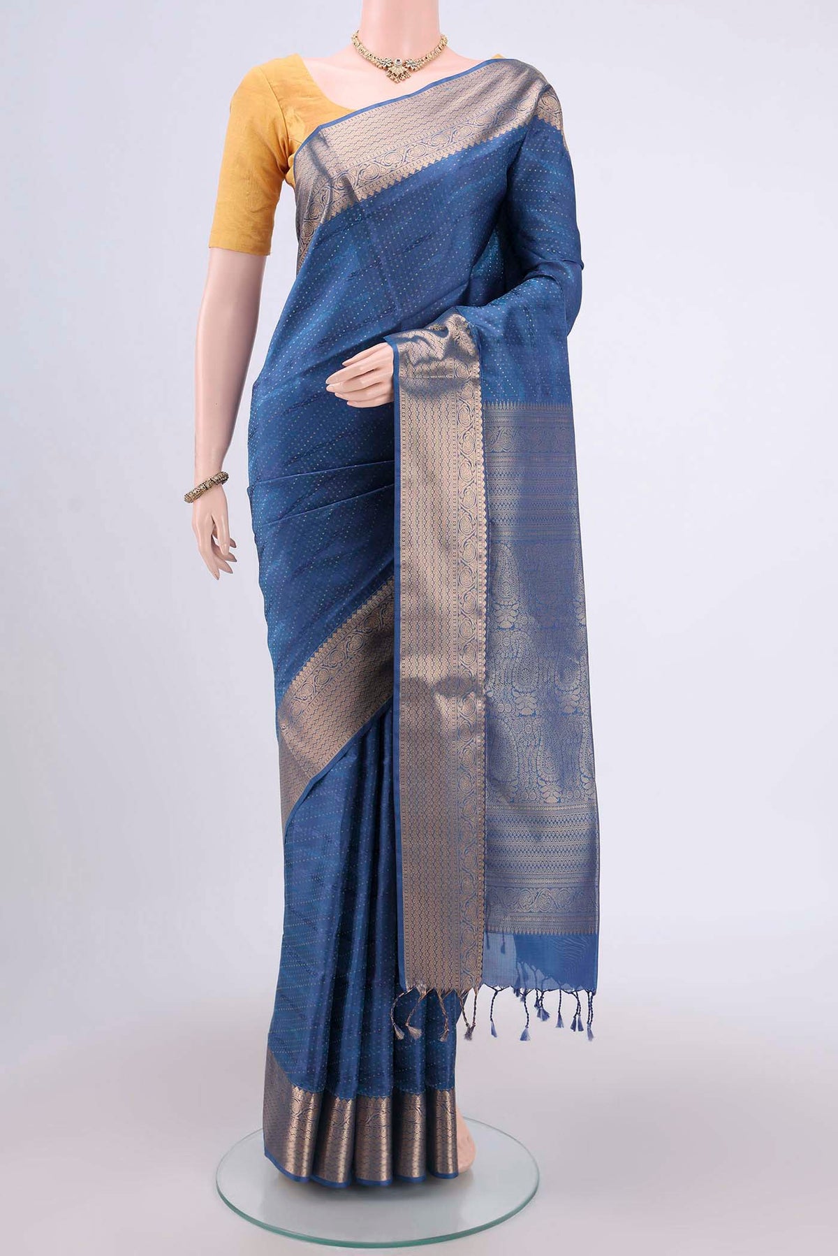 Blue Soft Silk Saree with Jacquard With Zari Butta on the body and Zari Border.  displayed on a mannequin