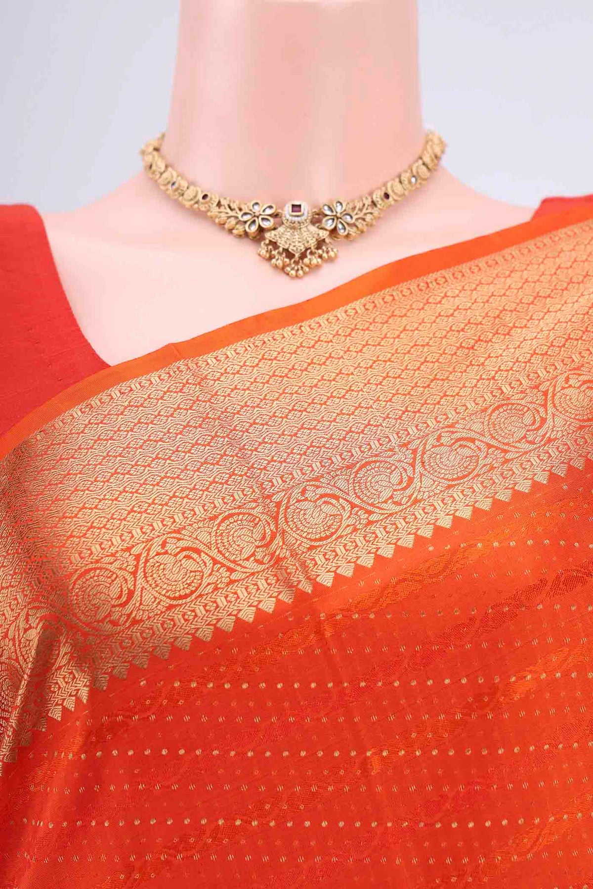 Border image of Orange Soft Silk Saree with Jacquard With Zari Butta on the body and Zari Border. 