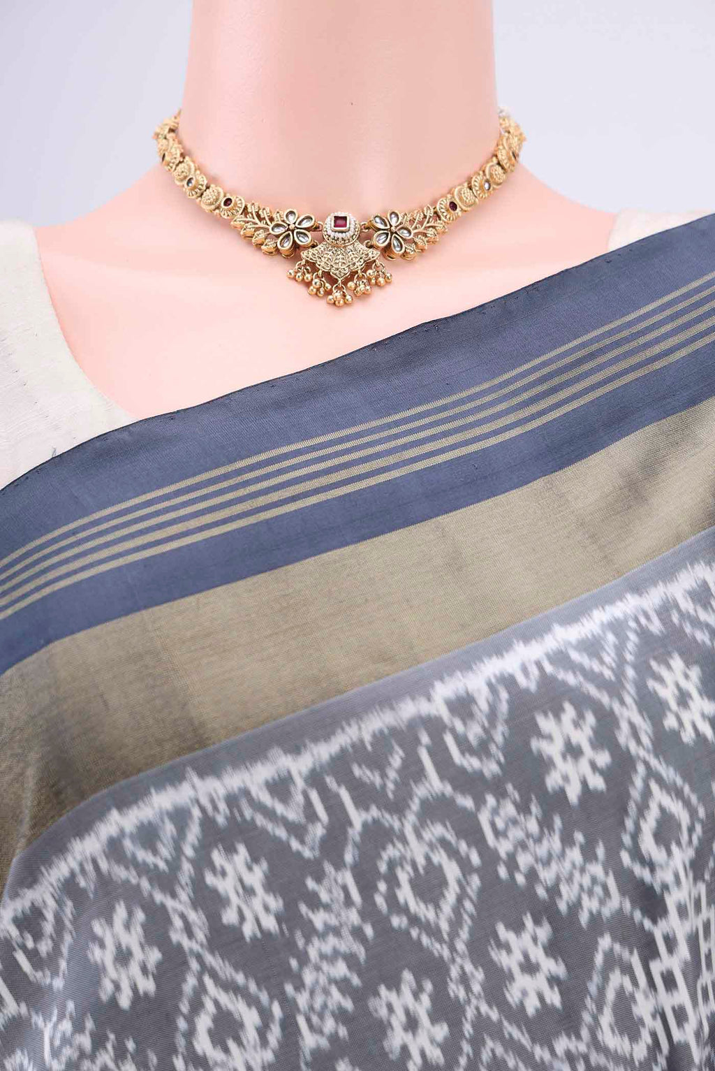 Border image of Grey Pochampally Silk Saree with Pure Ikat on the body and Zari Border. 