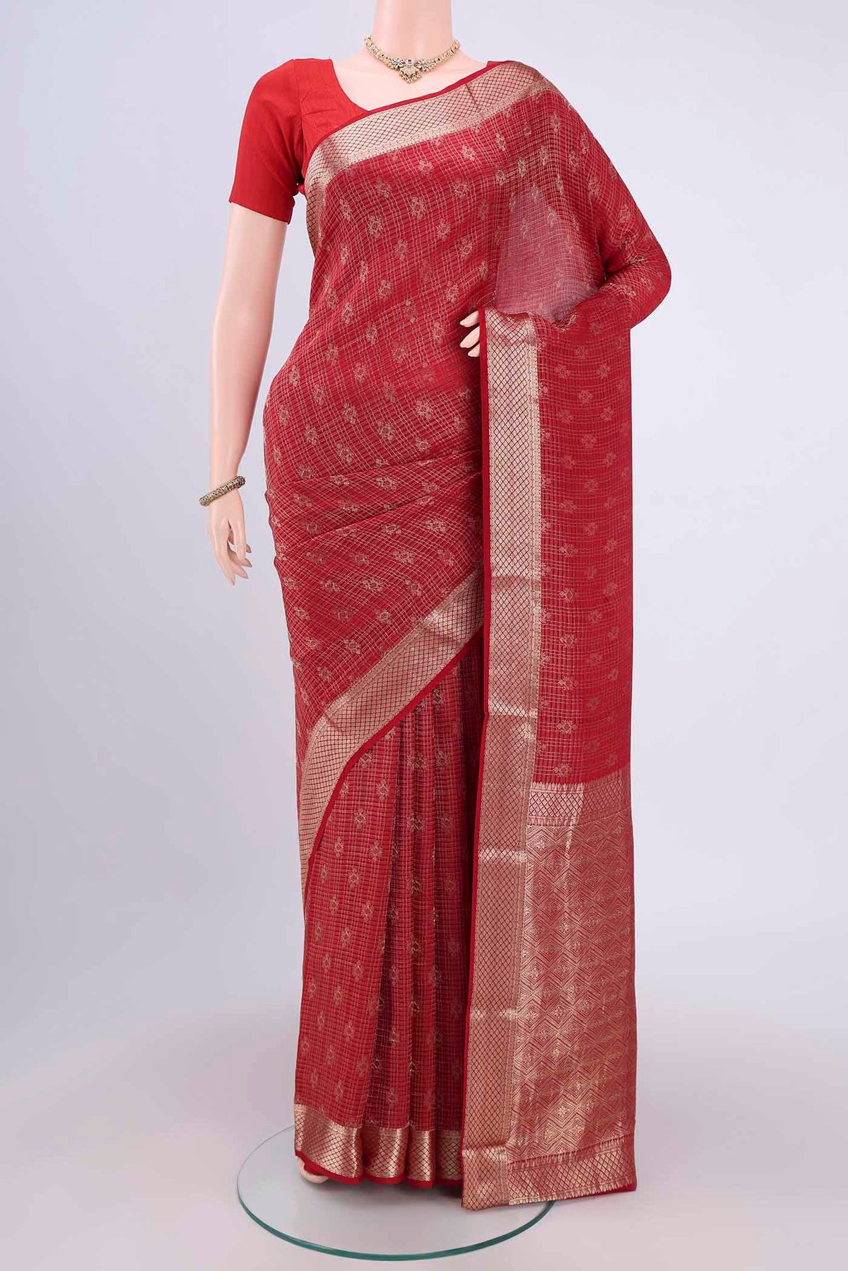 Red Mysore Crepe Saree with Zari Brocade on the body and Zari Border.  displayed on a mannequin