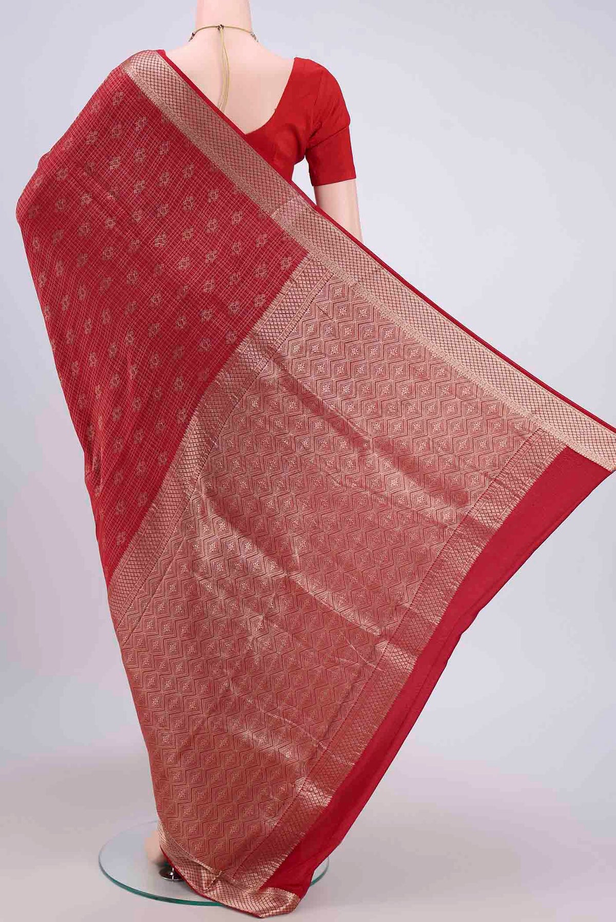 Flat view of Red Mysore Crepe Saree with Zari Brocade on the body and Zari Border. 