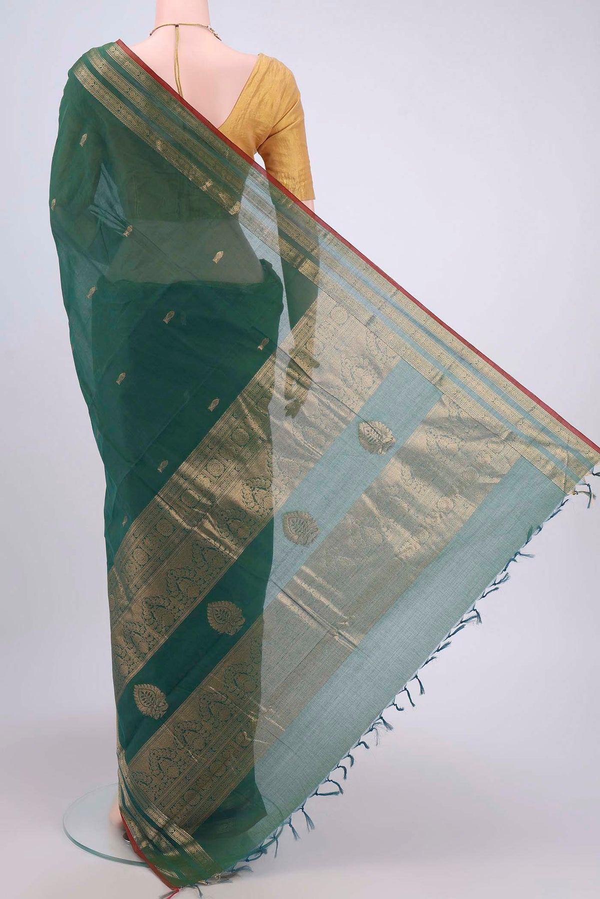 Flat view of Green Kanchi Cotton Saree with Zari Butta on the body and Zari Border. 