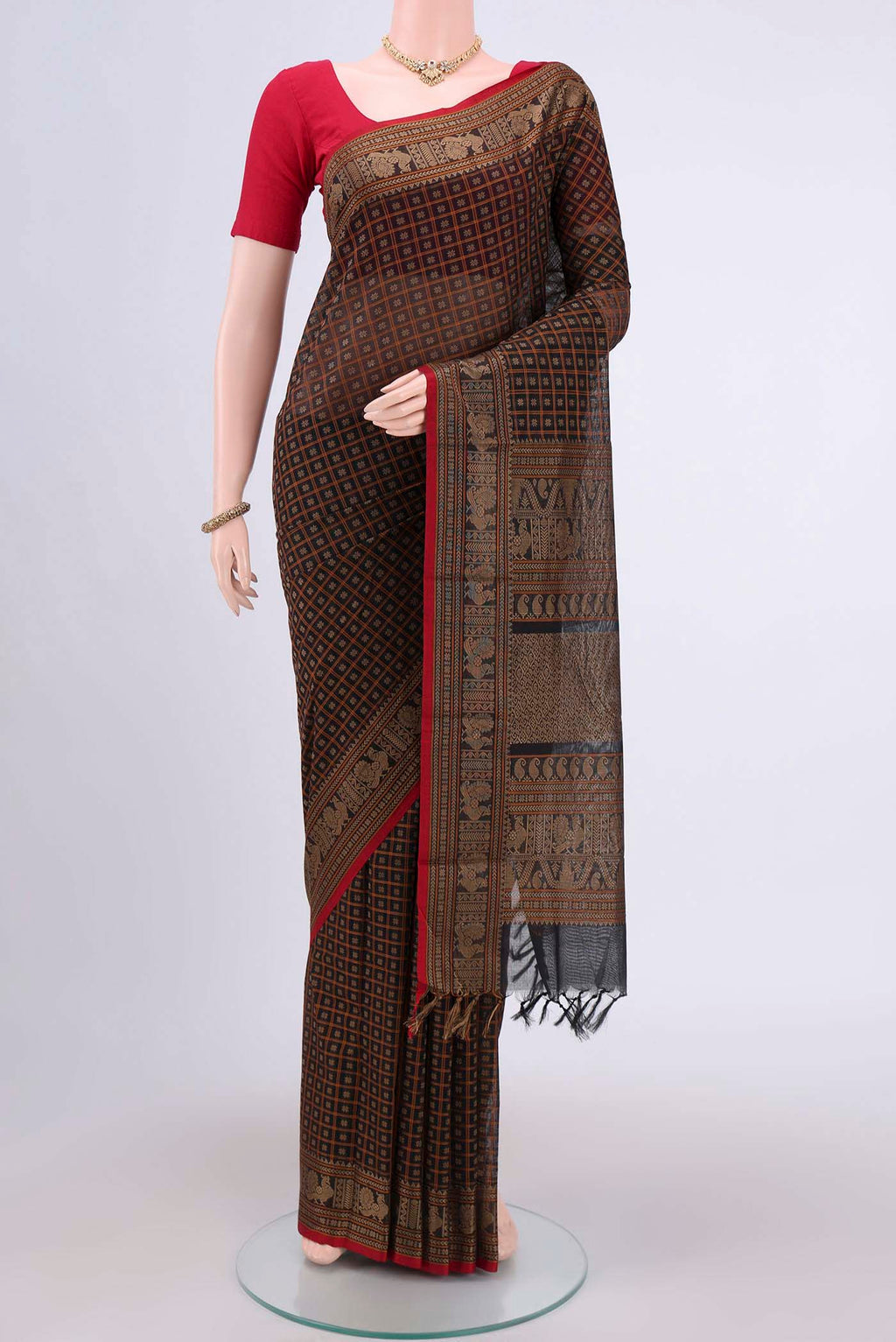 Black Kanchi Cotton Saree with Checked design on the body and Zari Border.  displayed on a mannequin