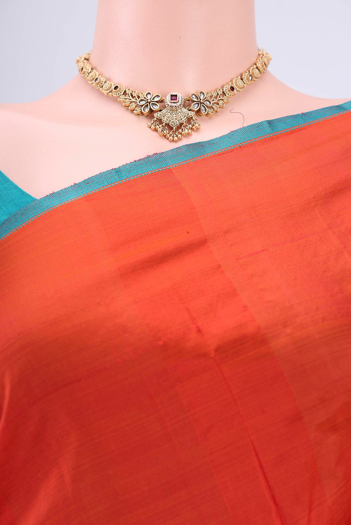 Border image of Brick Orange Kanchipuram Silk Saree with Plain Body and Thread Border. 