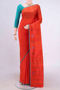 Brick Orange Kanchipuram Silk Saree with Plain Body and Thread Border.  displayed on a mannequin