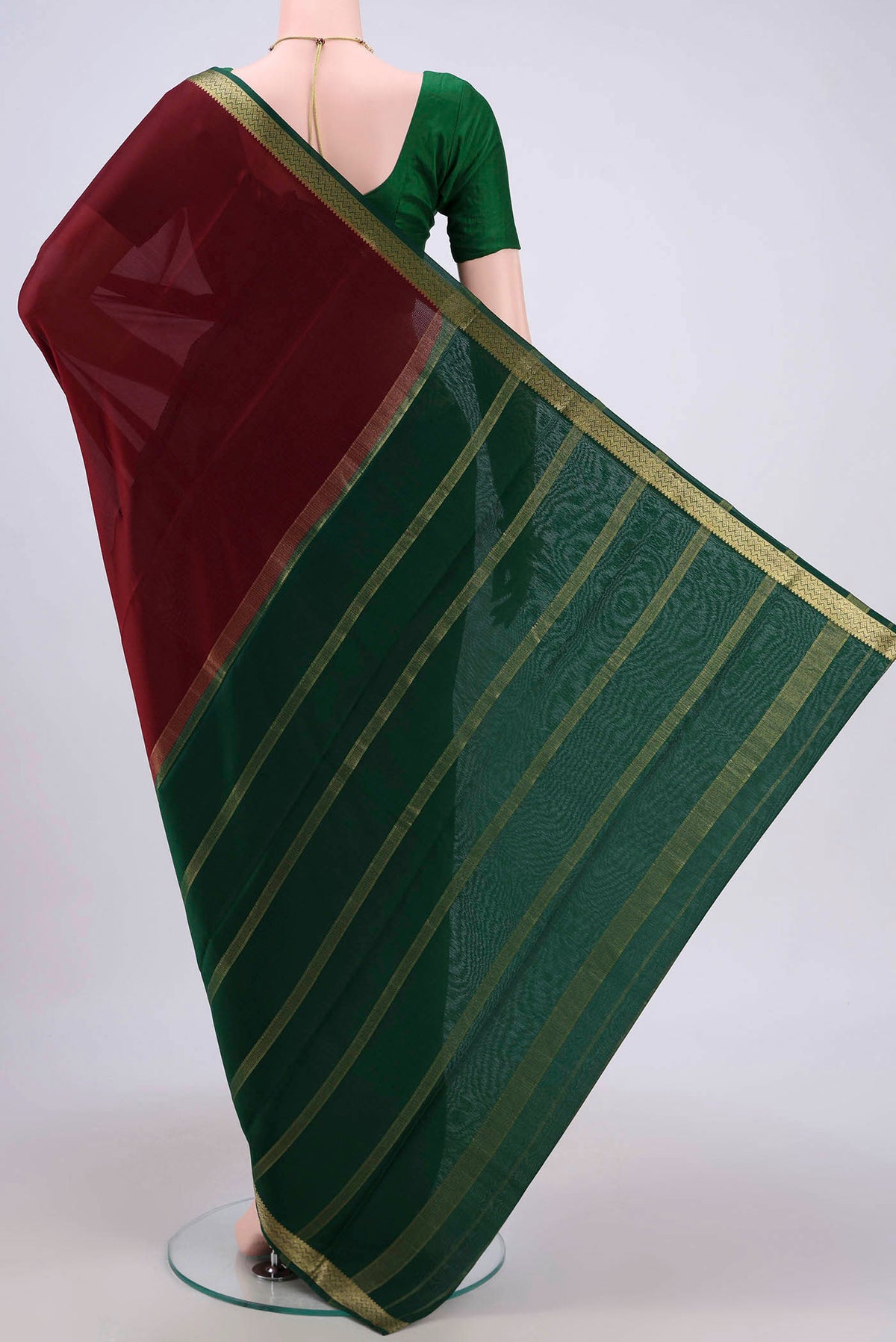 Flat view of Maroon Mysore Crepe Saree with Plain Body and Zari Border. 