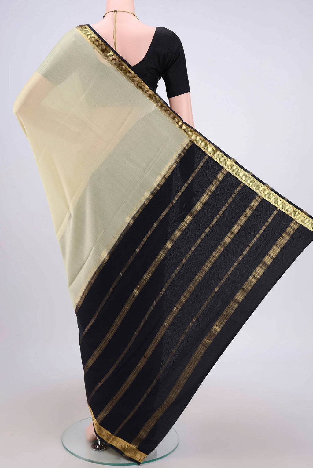 Flat view of Cream Mysore Crepe Saree with Plain Body and Zari Border. 