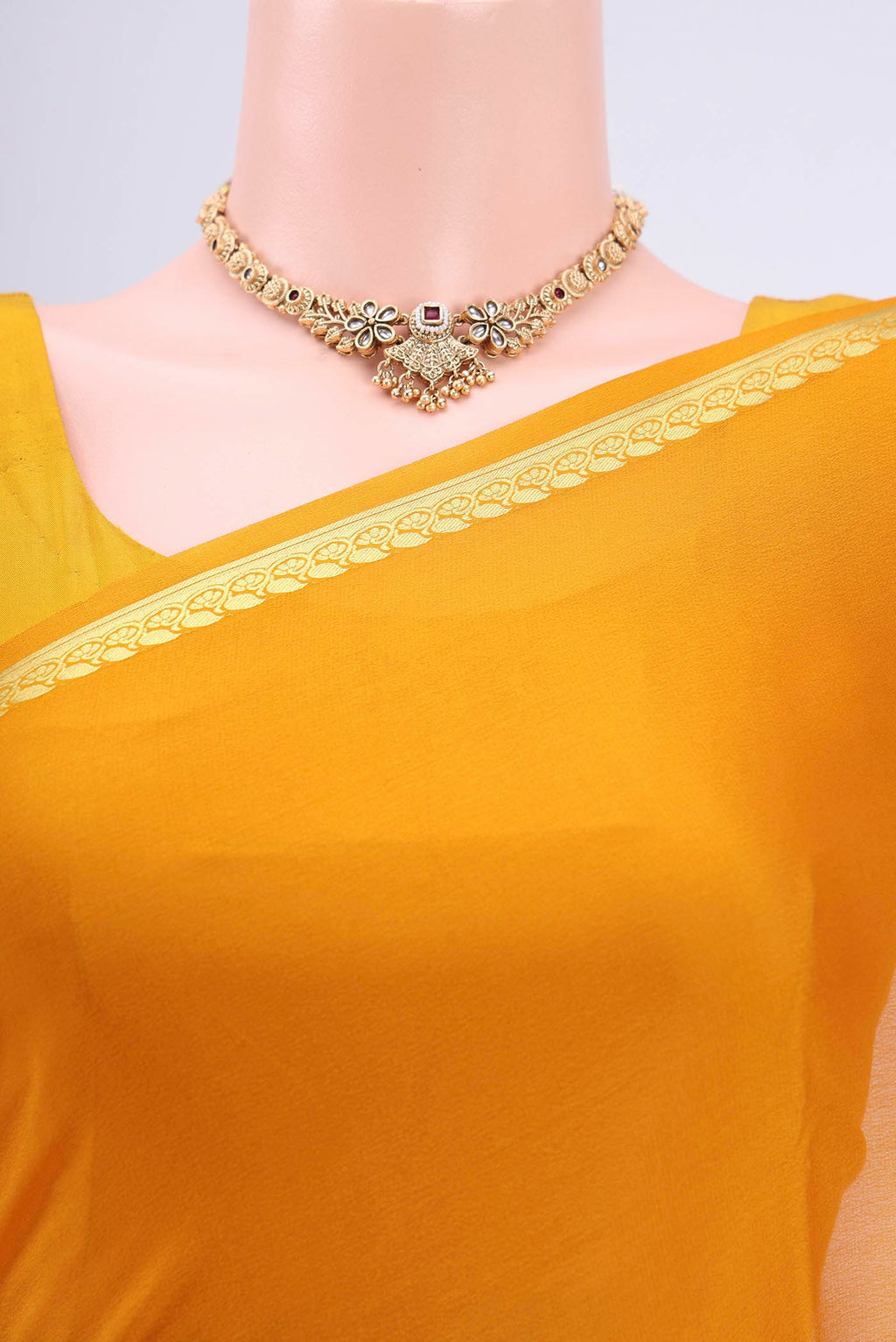 Border image of Mustard Mysore Crepe Saree with Plain Body and Zari Border. 