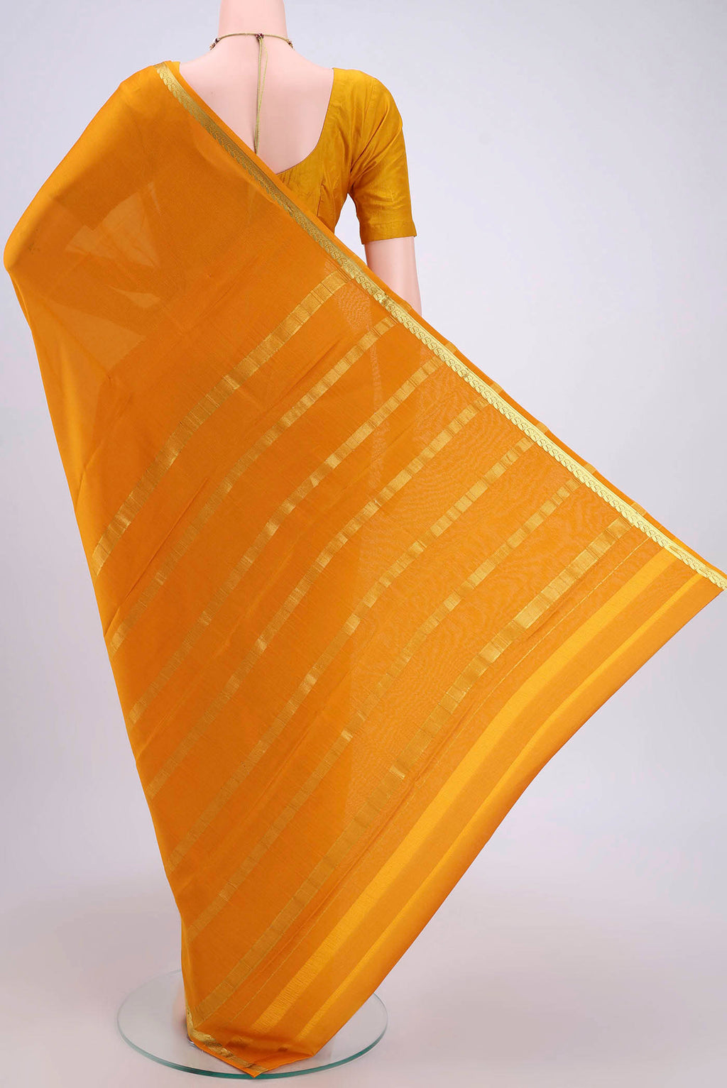 Flat view of Mustard Mysore Crepe Saree with Plain Body and Zari Border. 