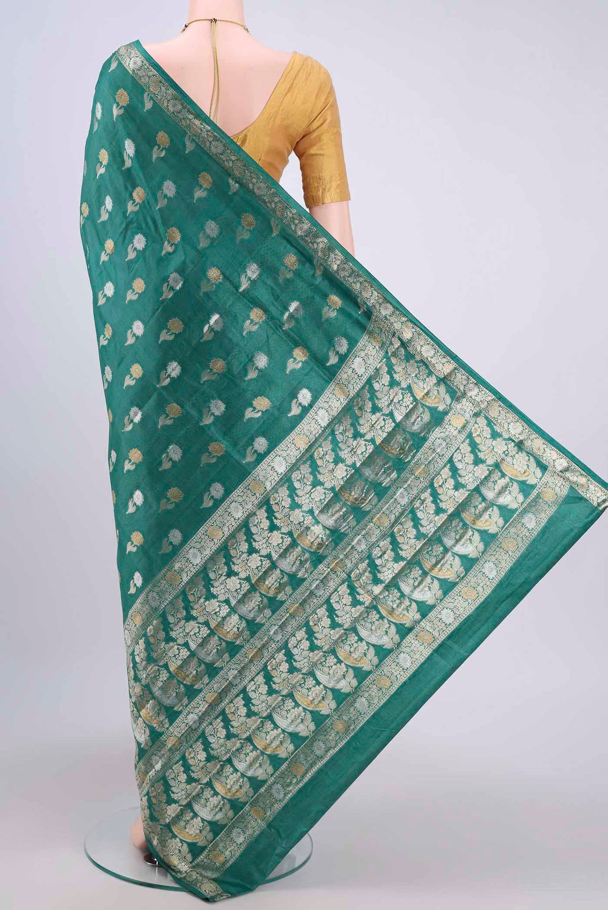 Flat view of Sea Green Banarasi Tussar Silk Saree with Zari Butta on the body and Zari Border. 