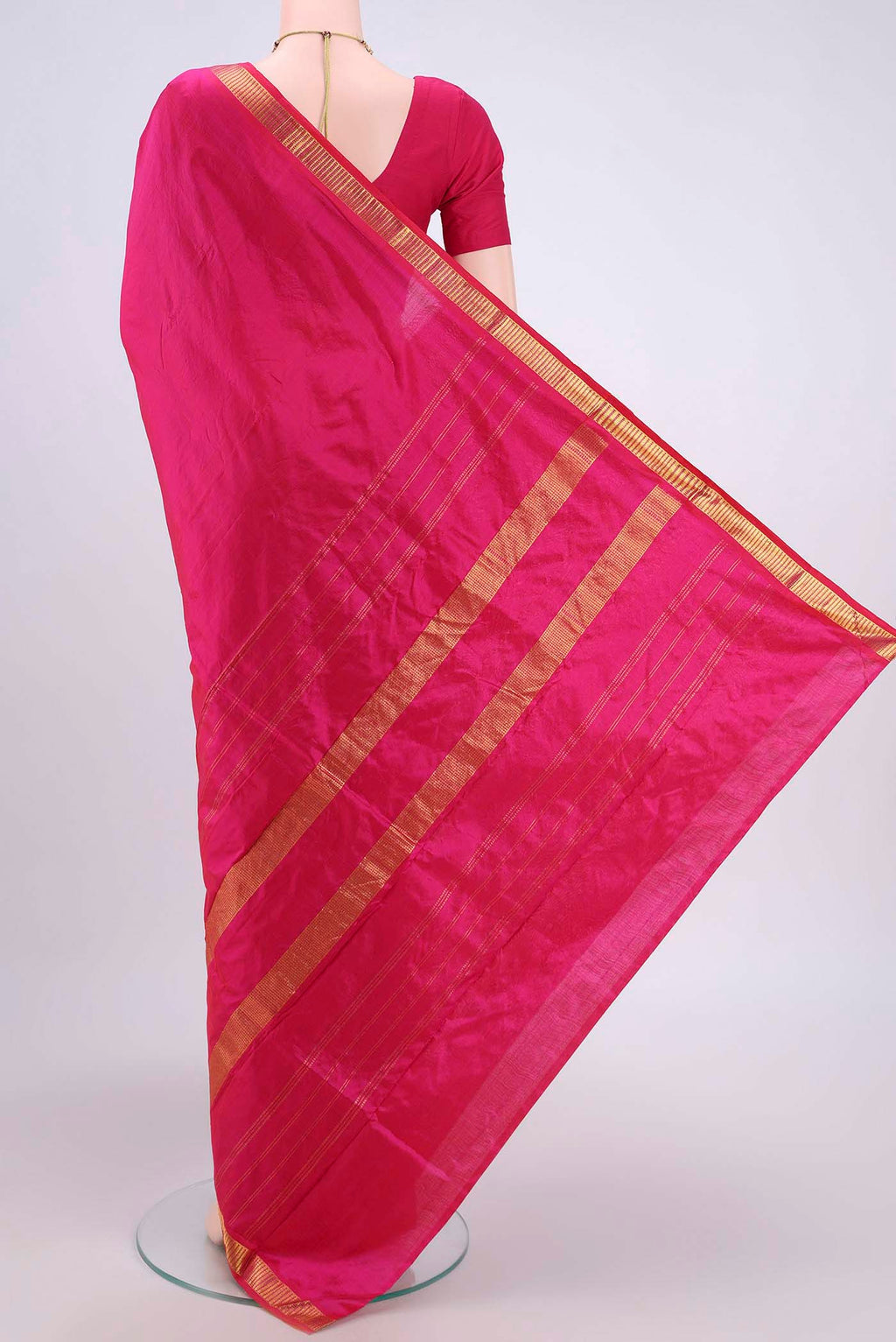 Flat view of Dark Pink Kanchipuram Saree with Plain Body and Zari Border. 