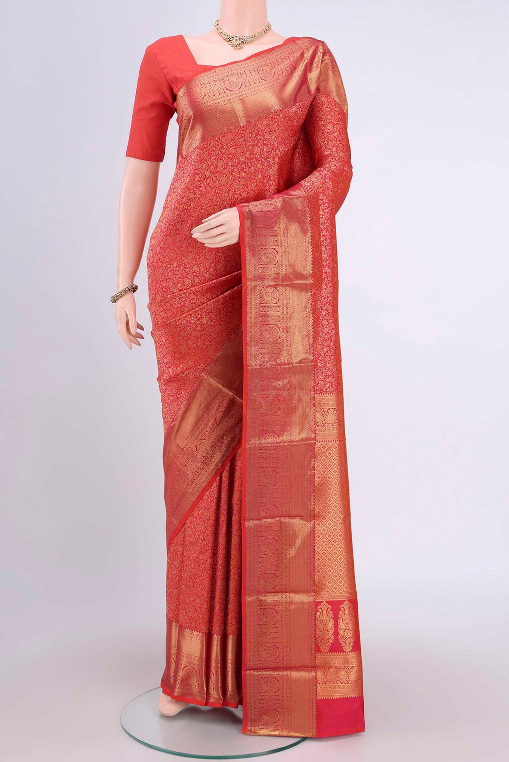 Rust Bangalore Silk Saree with Zari Brocade on the body and Zari Border.  displayed on a mannequin