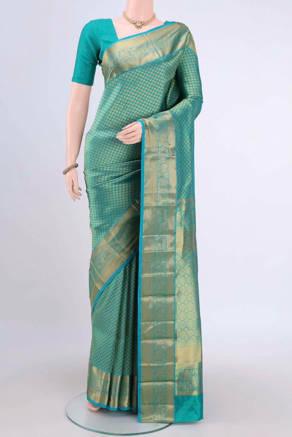 Sea Green Dual Tone Bangalore Silk Saree with Zari Brocade on the body and Zari Border.  displayed on a mannequin