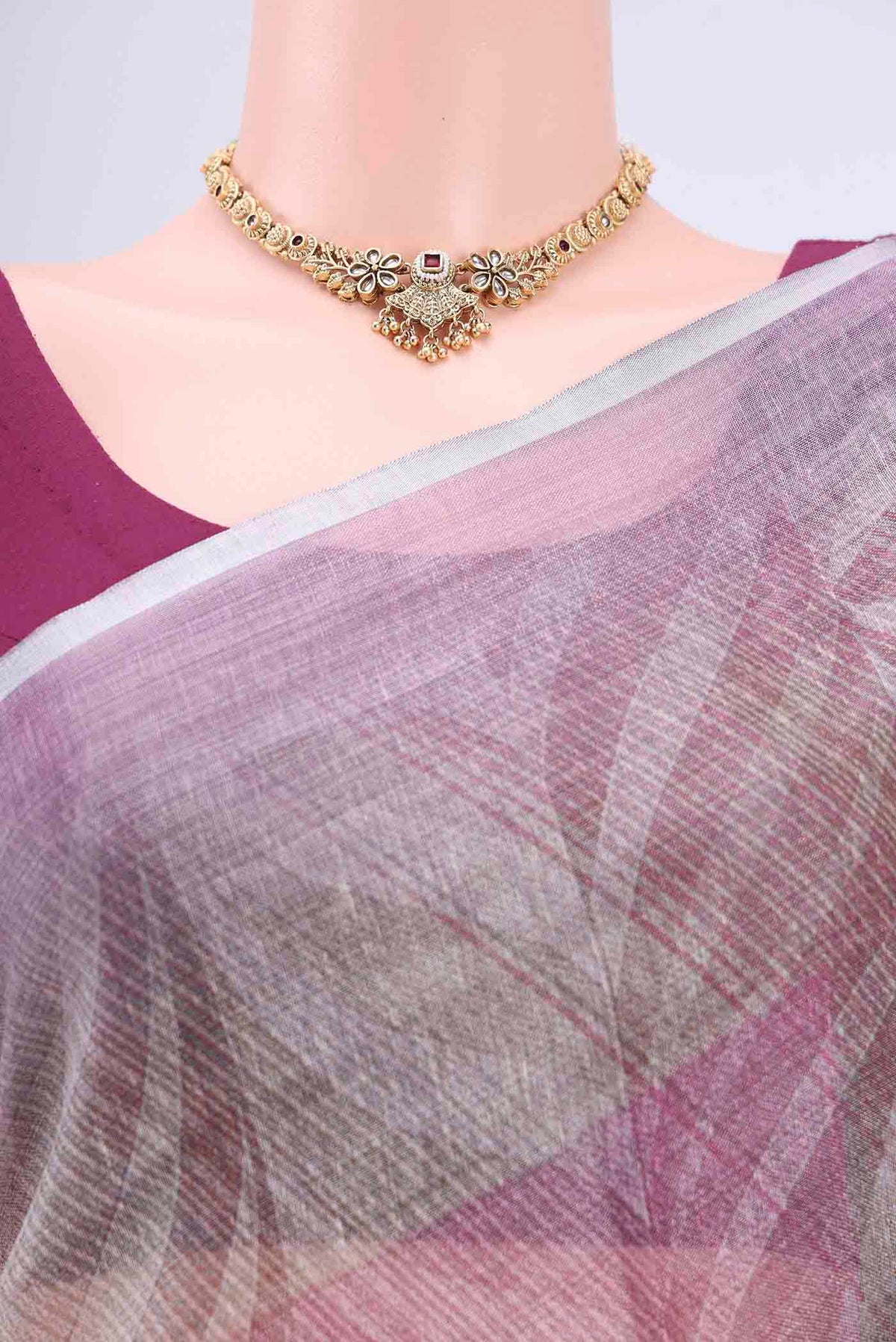 Border image of Mauve Linen Cotton Saree with Floral Print on the body and Zari Border. 