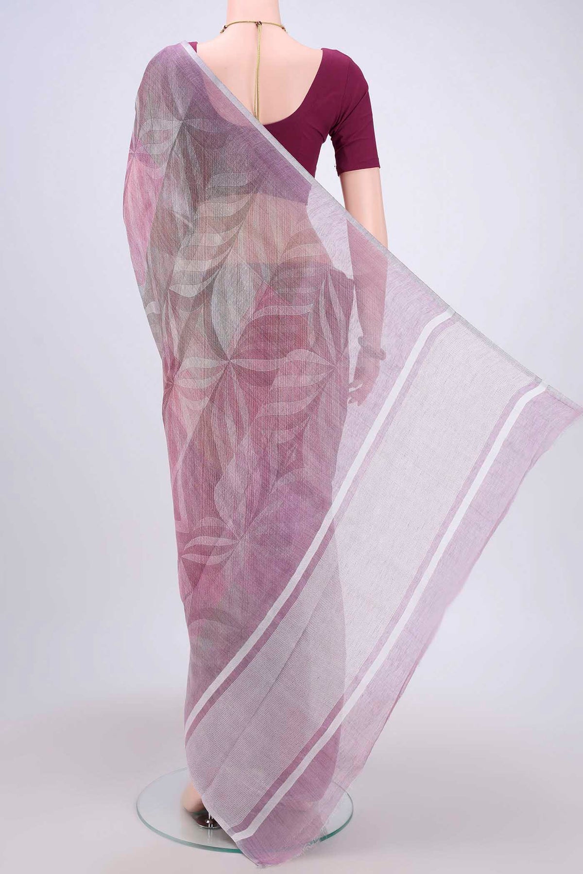 Flat view of Mauve Linen Cotton Saree with Floral Print on the body and Zari Border. 