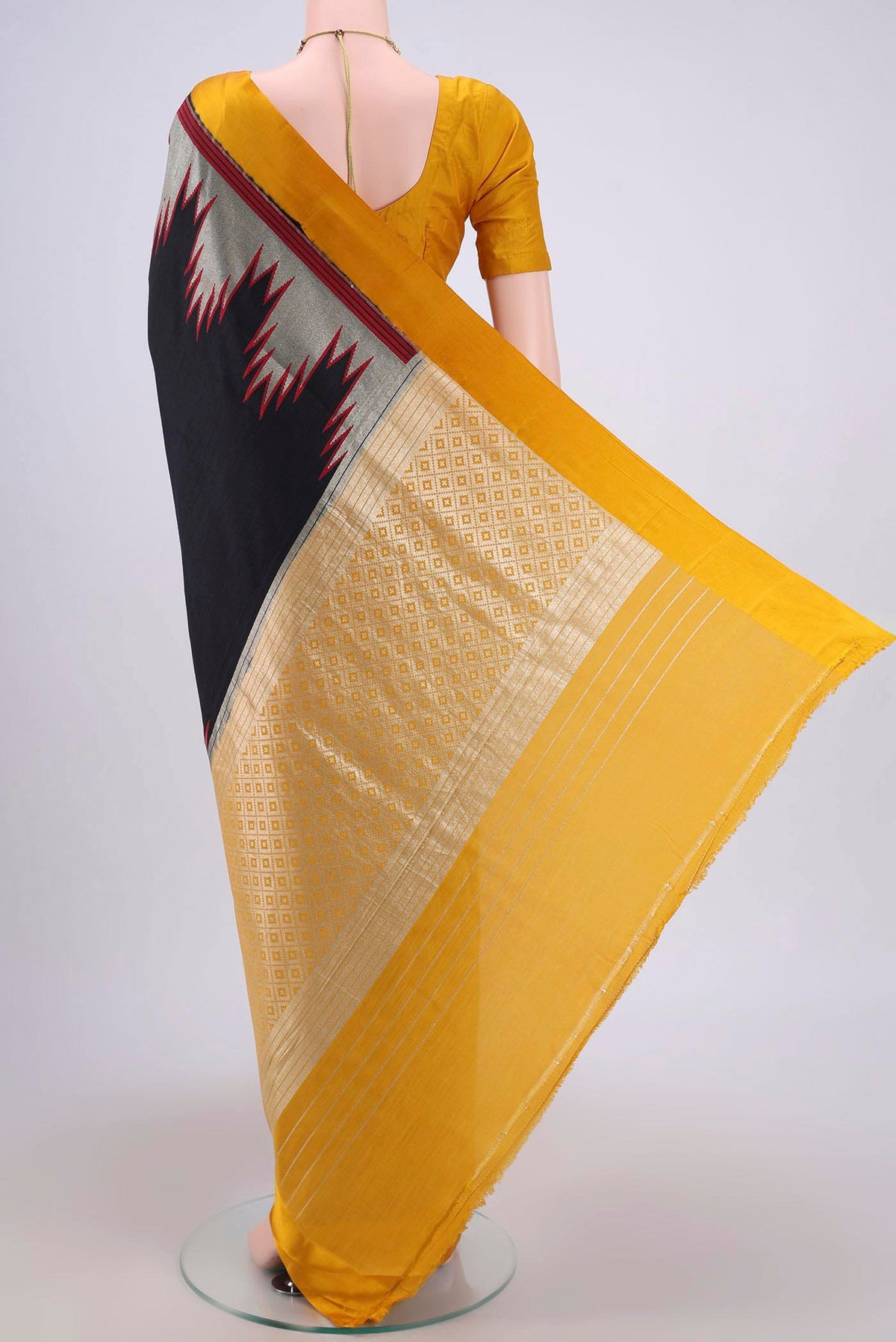 Flat view of Black Banarasi Silk Saree with Zari Butta on the body and Zari Border. 