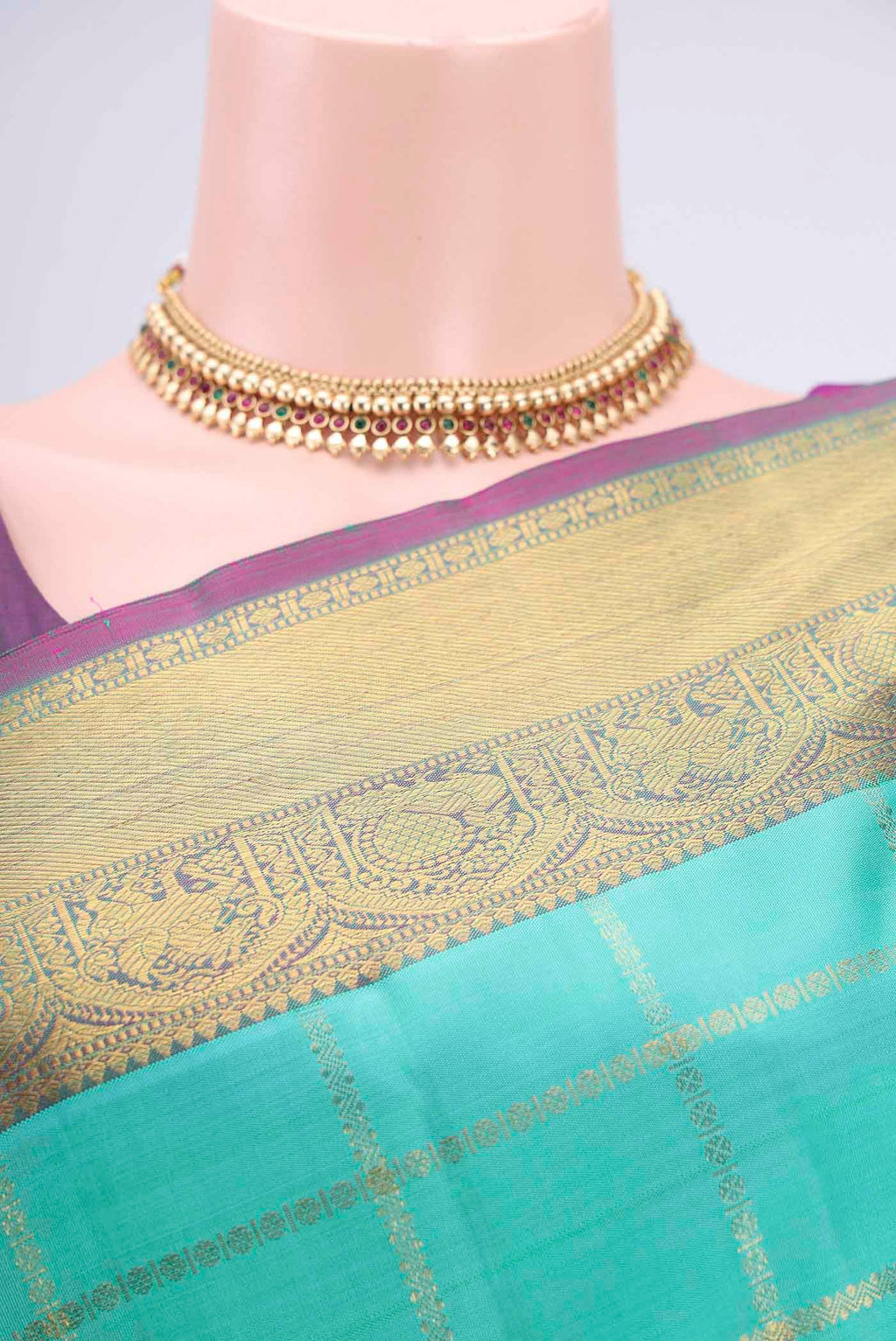 Border image of Turquoise Kanjivaram Saree with Zari Butta on the body and Zari Border. 