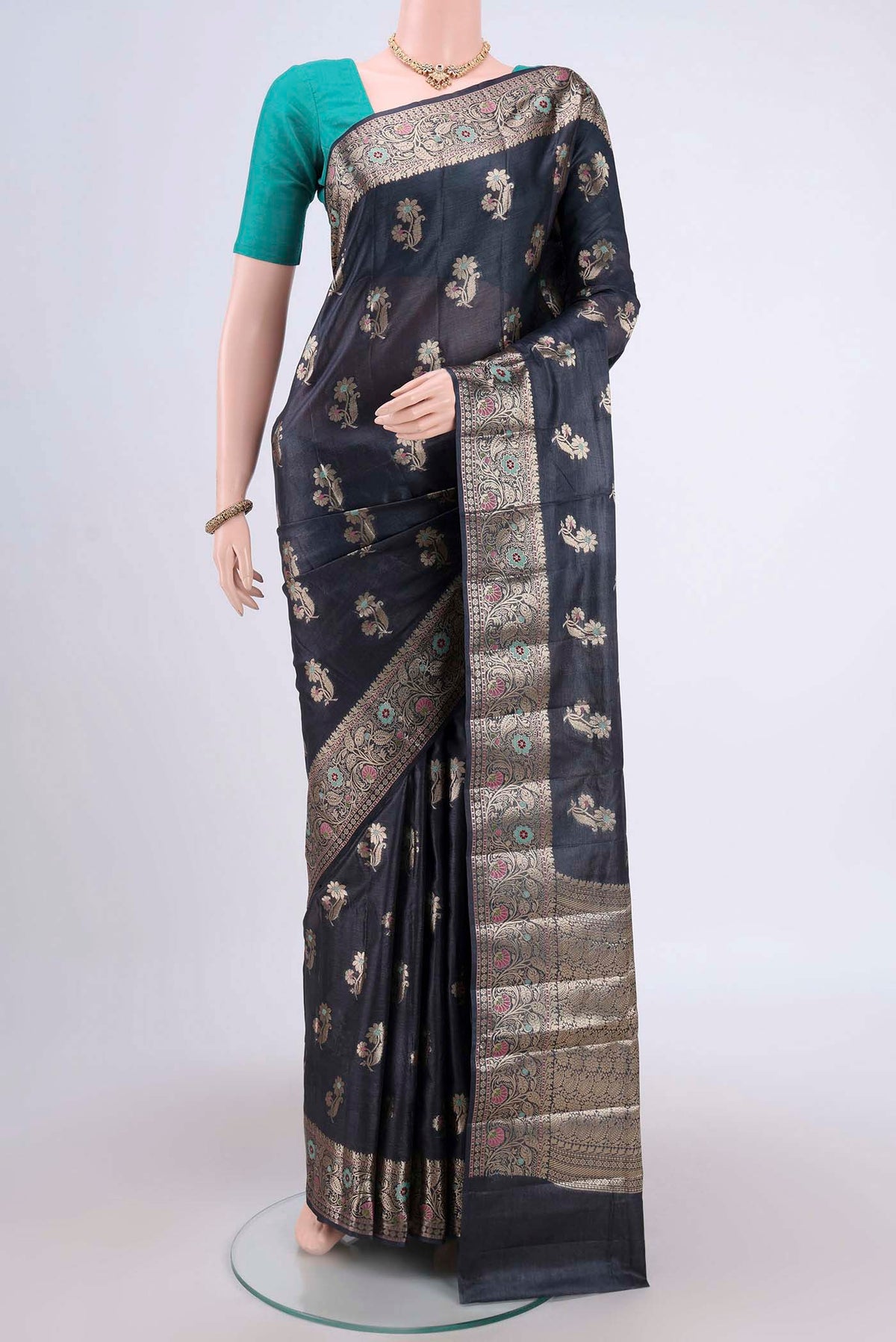 Davys Grey Banarasi Tussar Silk Saree with Zari And Thread Butta on the body and Zari And Thread Border.  displayed on a mannequin