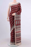 Maroon Maheshwari Silk Cotton Saree with Printed design on the body and Zari Border.  displayed on a mannequin