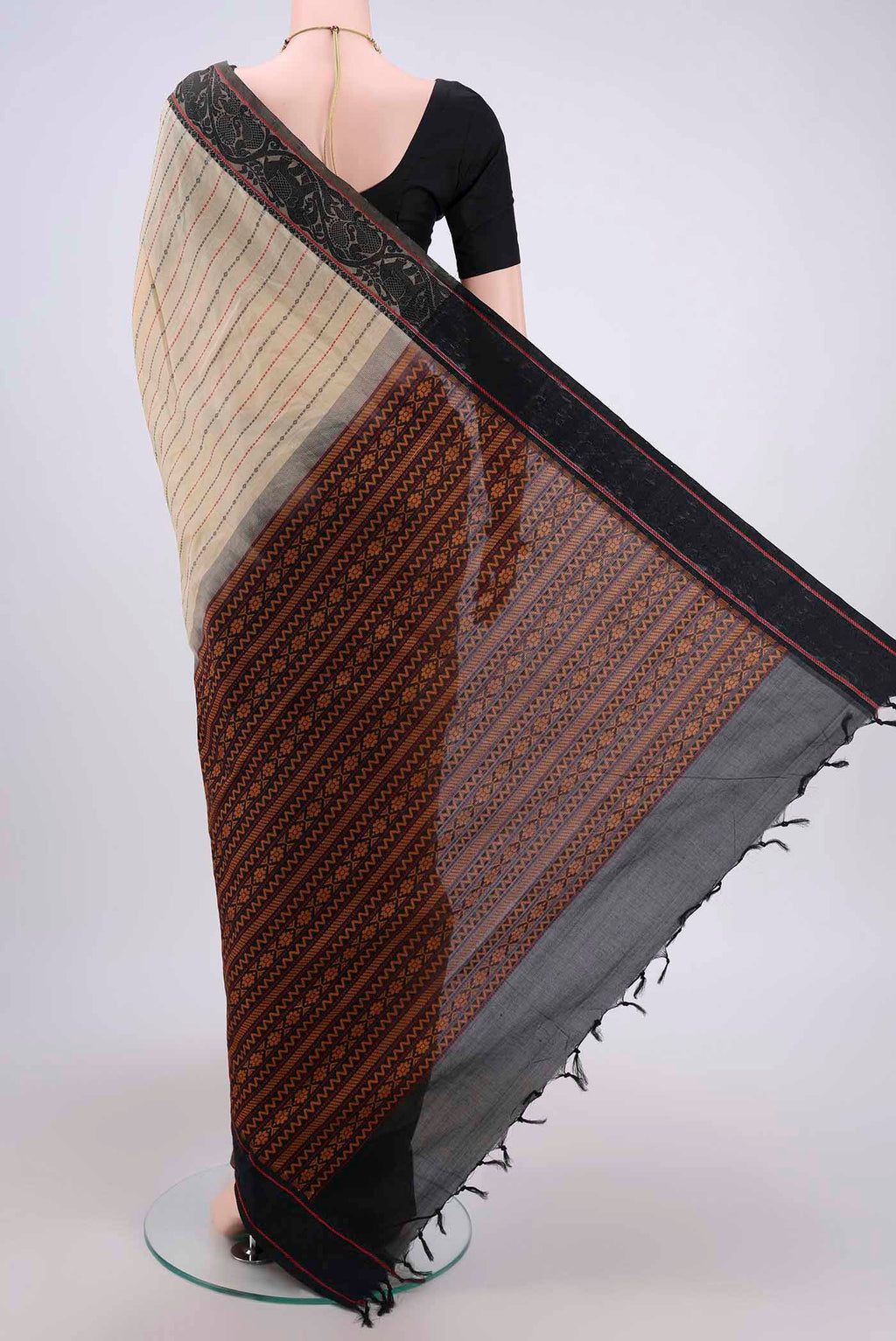Flat view of Beige Blended Silk Cotton Saree with Stripes on the body and Thread Border. 