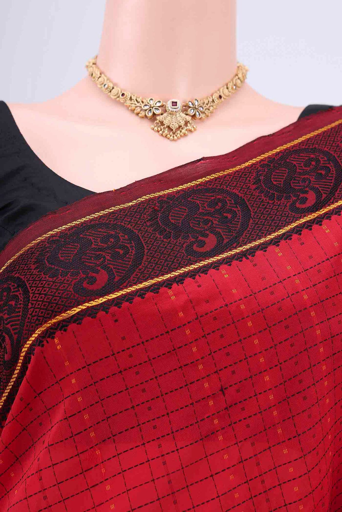 Border image of Red Blended Silk Cotton Saree with Checked design on the body and Thread Border. 