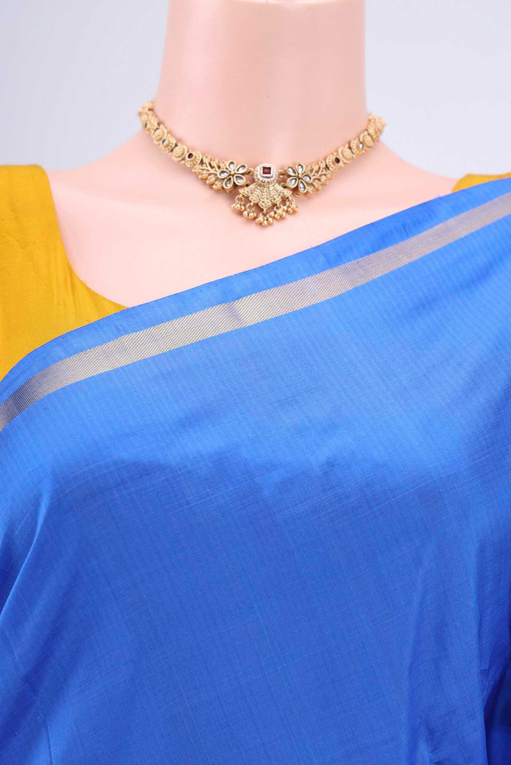 Border image of Blue Kanchipuram Saree with Plain Body and Zari And Thread Border. 