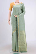 Sage Green Kanchipuram Saree with Zari Butta on the body and Zari Border.  displayed on a mannequin