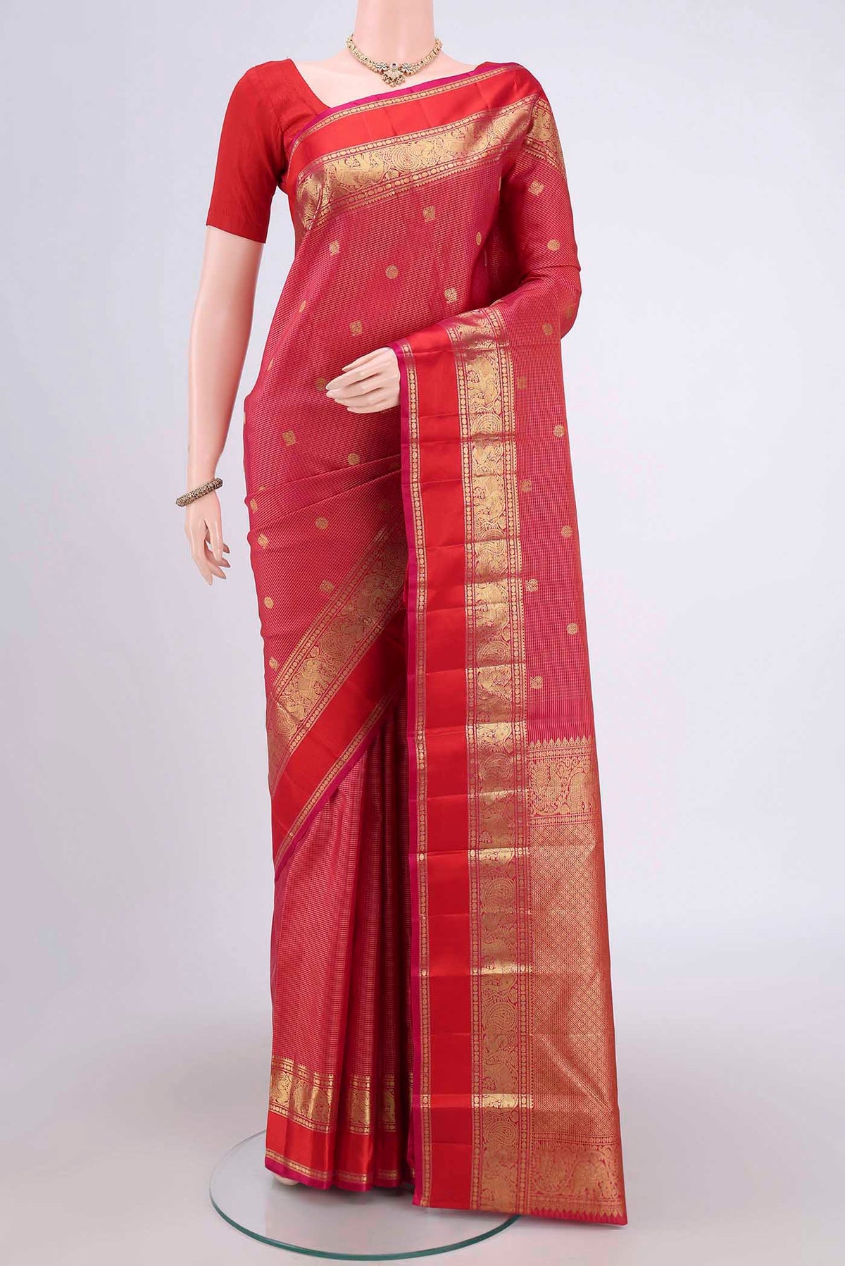 Dark Pink Dual Tone Kanjivaram Saree with Checked design on the body and Zari Border.  displayed on a mannequin