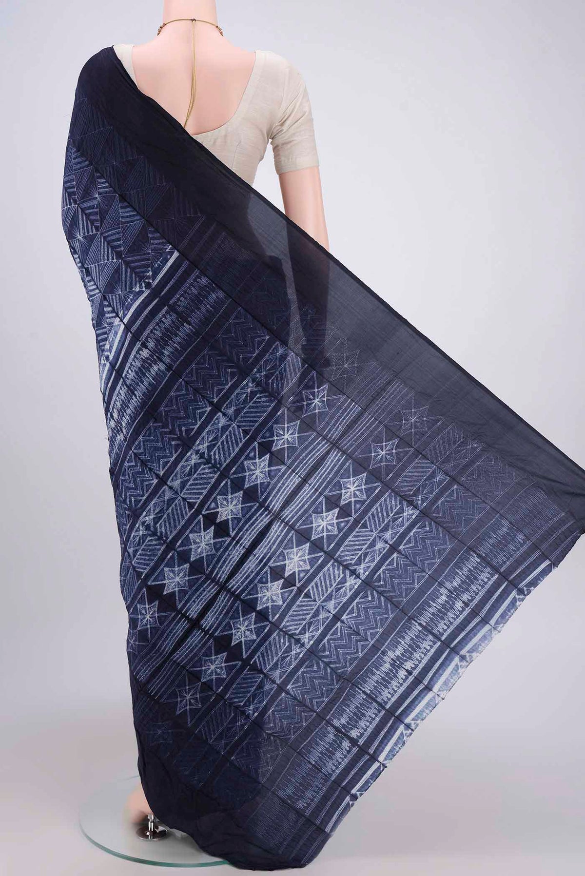 Flat view of Navy Blue Printed Silk Saree with Printed design on the body and Plain Border. 
