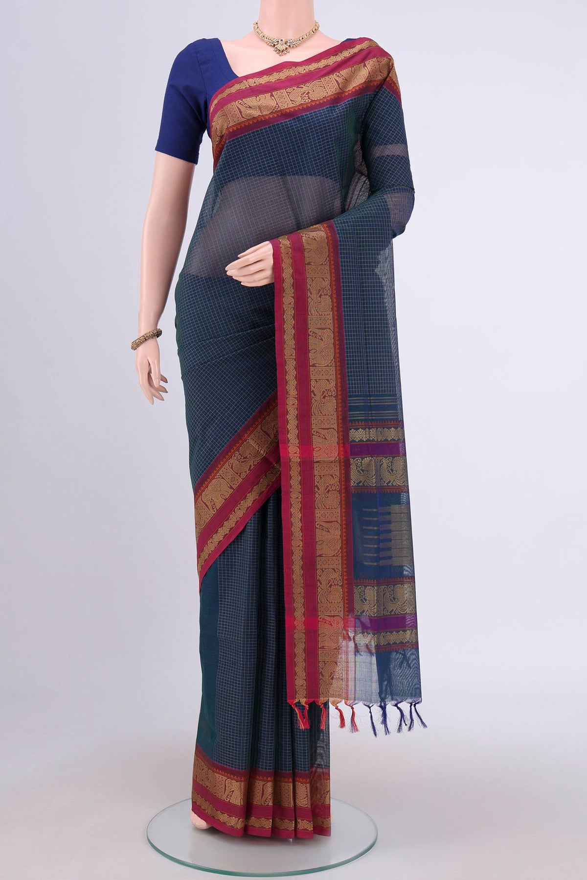 Blue Coimbatore Cotton Saree with Checked design on the body and Plain Border.  displayed on a mannequin